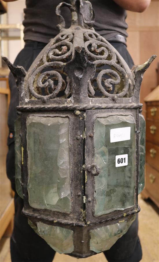 An early 20th century black painted wrought iron hall lantern, drop 65cm